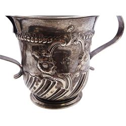 George II silver porringer, the part fluted body with twin curved strap handles, repousse decorated with a scroll and flower head reserve initialled WSB and rope border, hallmarked London 1755, makers mark probably Wm Shaw & Wm Preist, H11cm, approximate weight 8.89 ozt (276.4 grams)