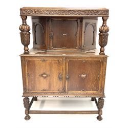 Early 20th century carved oak court cupboard fitted with single cupboard above double cupboard doors, melon fluted acanthus carved supports joined by perimeter stretcher