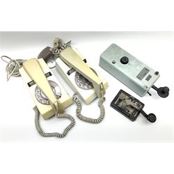 German bakelite morse code key marked 'Entstort' and 'D.R.P. Junker' L15cm; another bearing plaque 'N.S. No.5805-99-580-8558 KEY TELEGRAPH Ser. No. PES597 1973'; and two 1970s turn-dial Trimphones (4)
