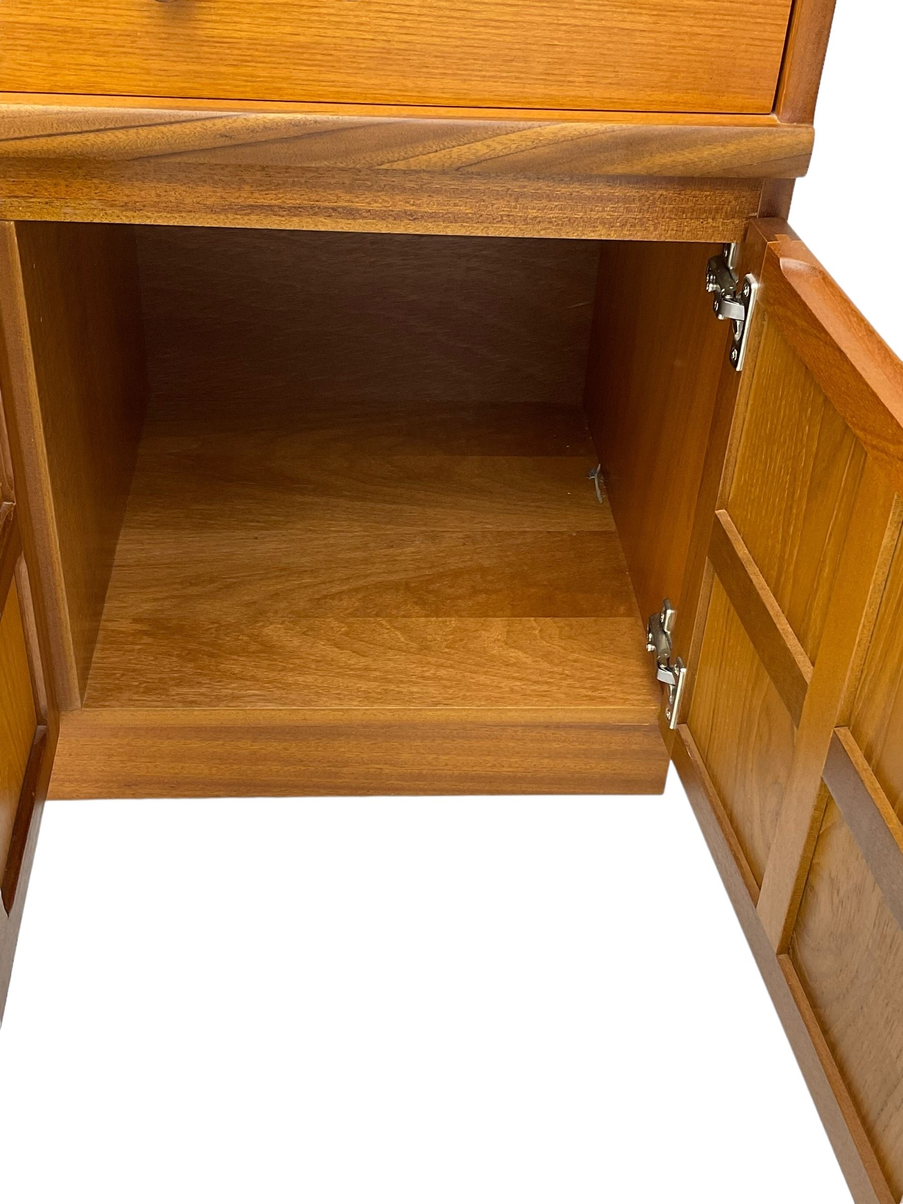 Nathan - teak wall display cabinet, enclosed by three glazed doors, fitted with four drawers and three cupboards 