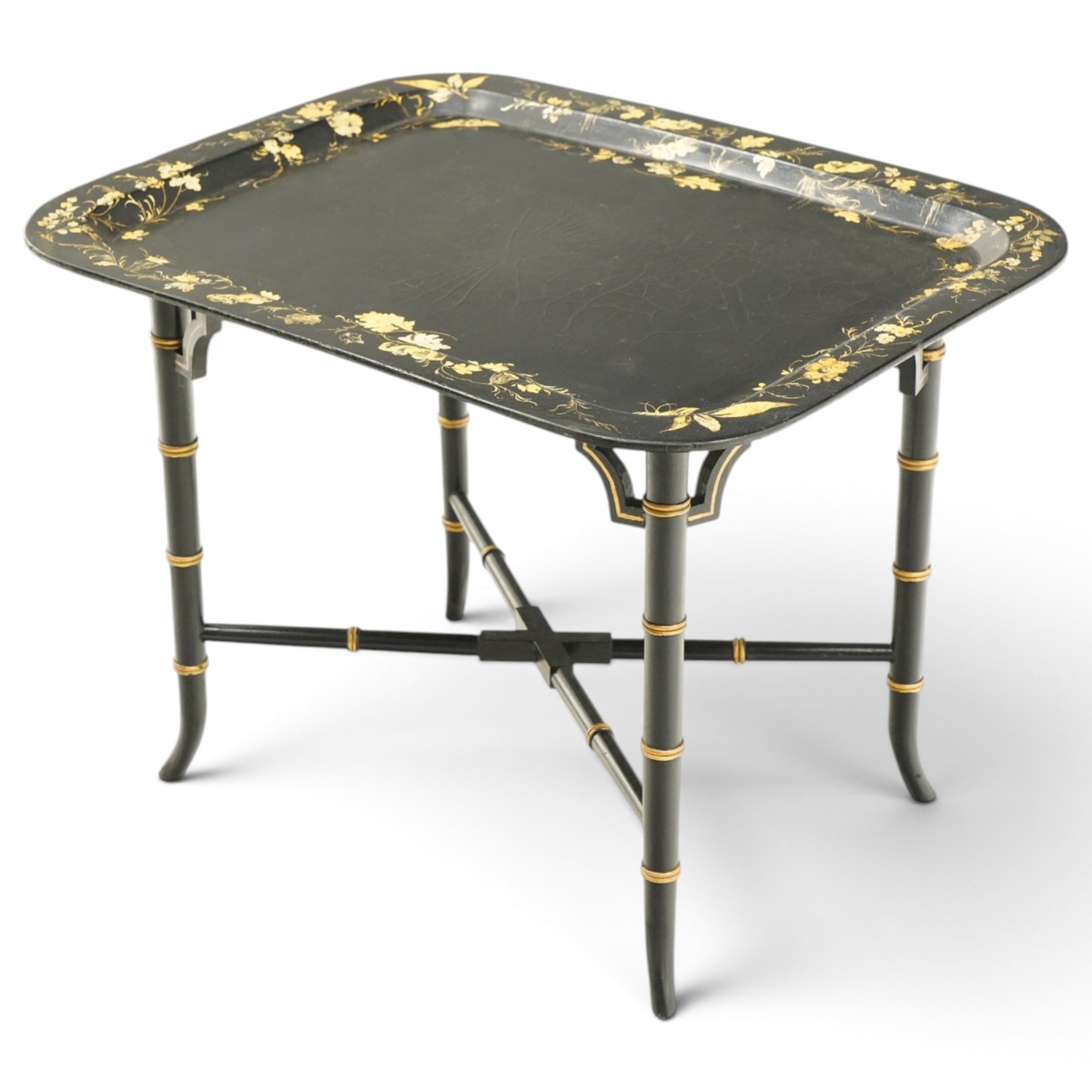 Victorian ebonised and gilt-painted papier-mâché tray on later ebonised and parcel-gilt simulated bamboo stand, the rectangular removable tray with gilt foliate and butterfly scenes with scrolling branches, the base on four ring-turned and splayed supports united by X-stretcher