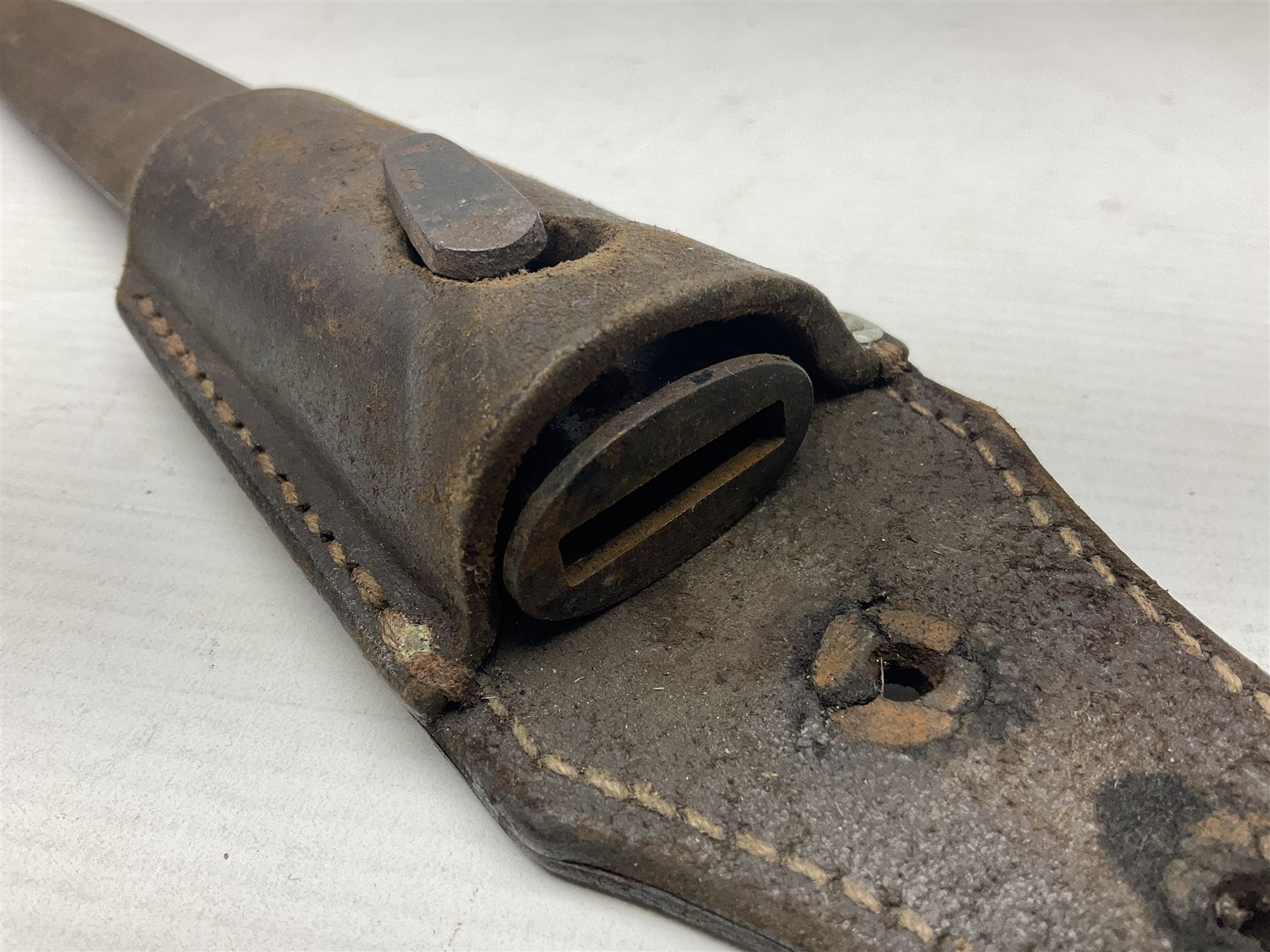 WWII German K98 (short) NCO dress bayonet, the 20cm fullered blade marked Anton Wingen Solingen to the ricasso, with chequered black grip plates; in steel scabbard with indistinctly stamped leather frog |L37cm overall