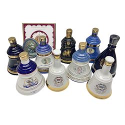 Bells, Scotch whisky, in seven Wade ceramic decanters, to include 50 year reign HM Queen Elizabeth II, Ninetieth Birthday of the Queen mother, 1991 year of the sheep, etc, together with two empty decanters and other items 