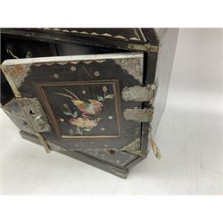  Late 19th / early 20th century Japanese lacquered table top cabinet, heavily decorated with mother of pearl inlay depicting blossoming branches, flowers and birds, the two hinged doors between longer drawers opening to reveal interior fitted with four short drawers, with lift up hinged canted lid, H28cm D9.5cm W23cm, together with mother of pearl inlaid miniature folding screen, dish decorated with walking figures with crimped edge, boxes decorated with flowers, birds and gilt etc