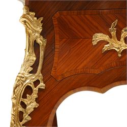 Baggio Anciens Meubles - Italian Louis XV style kingwood and gilt metal mounted bureau plat or writing desk, the shaped rectangular top with inset leather writing surface with gilt metal edge, above three shaped frieze drawers with gilt metal handles, raised on cabriole supports with gilt cartouche mounts to the knees and scroll feet
