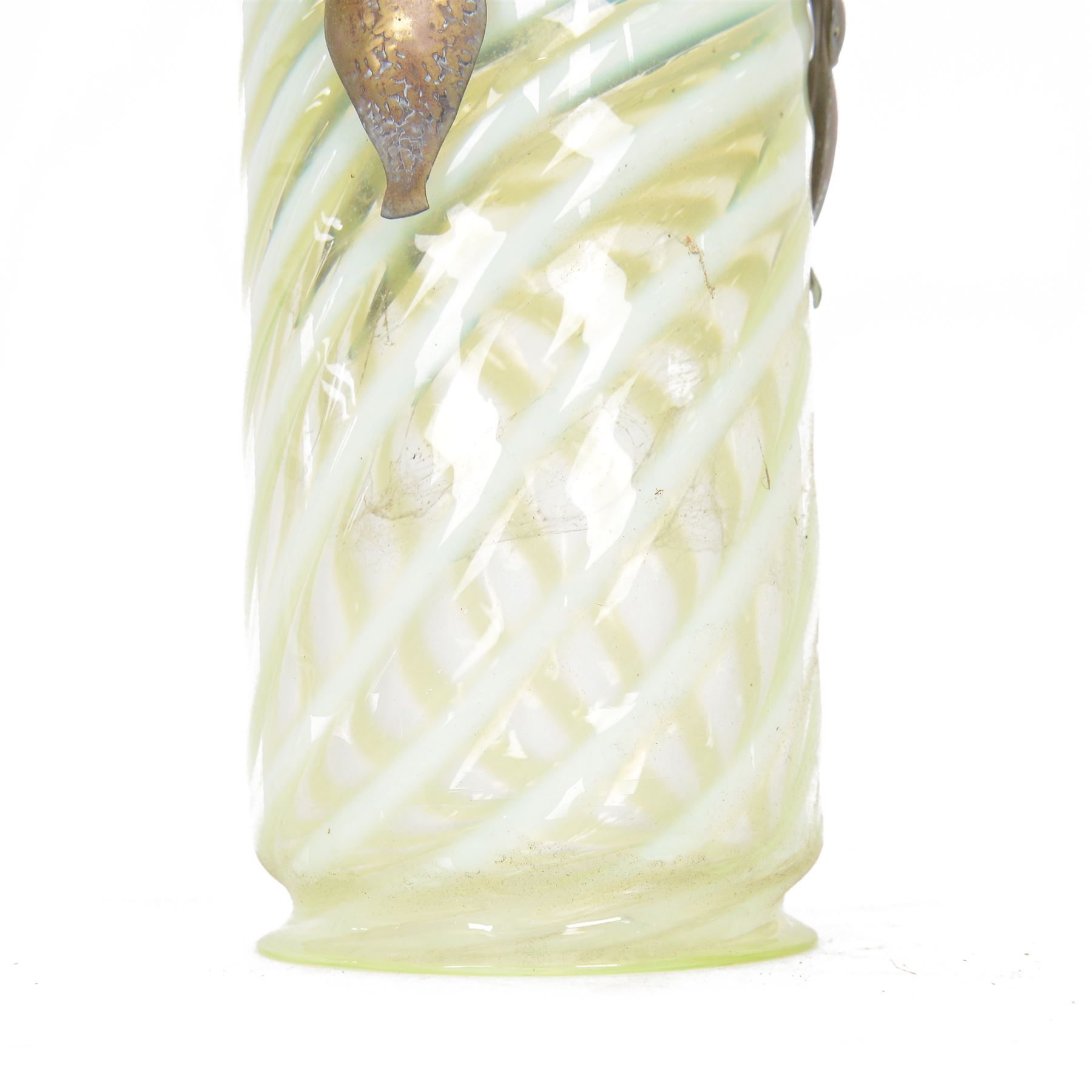 Arts & Crafts brass ceiling lantern with a trio of fluer-de-lis mounted arms, the vaseline glass pendant light shade of cylindrical form with flared rim, H52cm