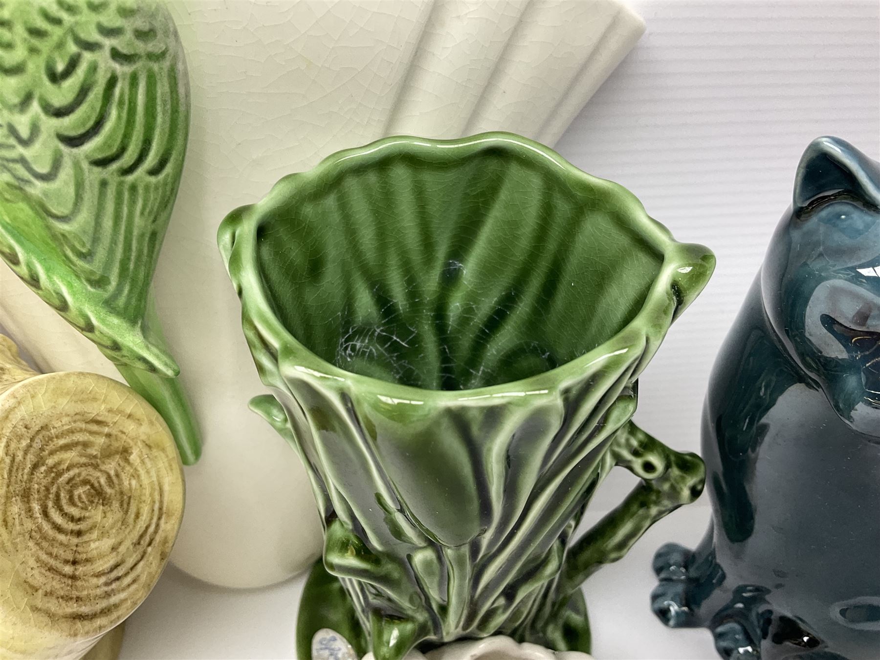 Sylvac budgieregar wall pocket, together with other Sylvac cermics including swan vases, blue tit vase and a frog figure etc, all with printed or impressed marks beneath, and a Poole Pottery cat figure, with printed mark beneath, wall pocket H22cm