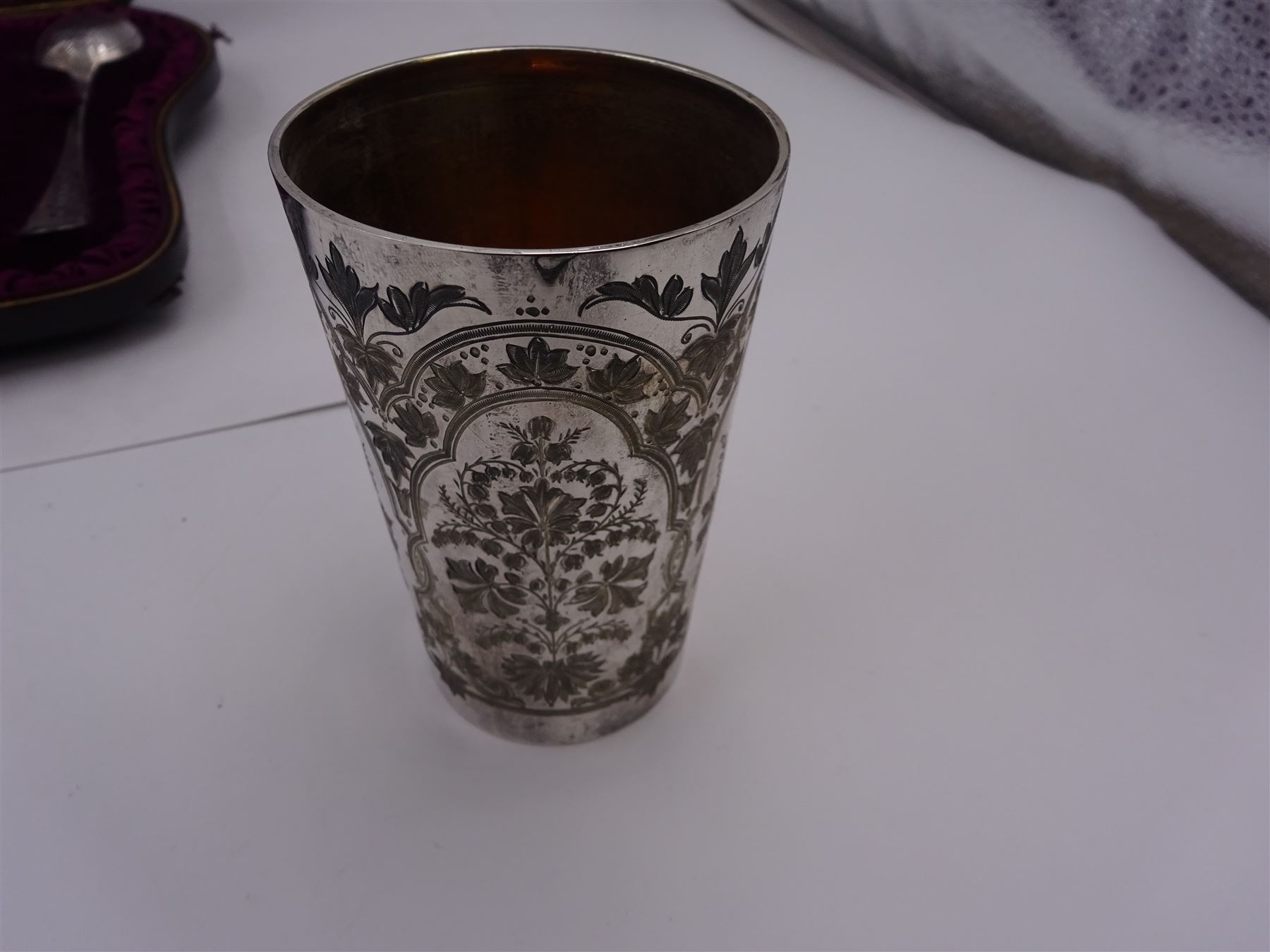 Victorian silver four piece christening set, comprising a beaker mug, napkin ring, fork and spoon, with bright cut floral decoration and monogrammed initials to each item, mug hallmarked Mappin & Webb (John Newton Mappin), Sheffield 1884, within tooled leather fitted case