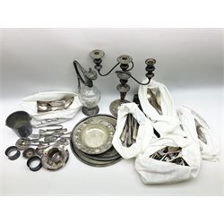 Silver-plated candelabra, claret jug , four trays and a collection of cutlery including cased fish knives serving spoons etc. 