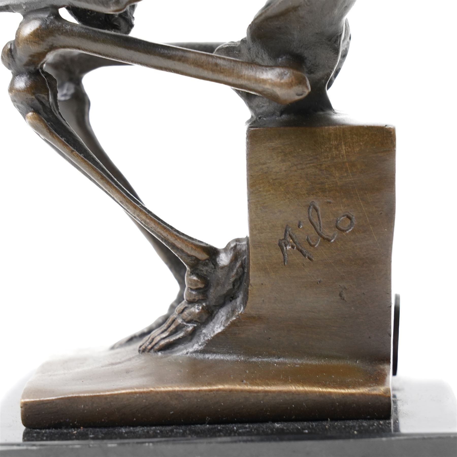 Bronze skeleton modelled as 'The Thinker', on black marble base, signed 'Milo' to plinth, H14cm