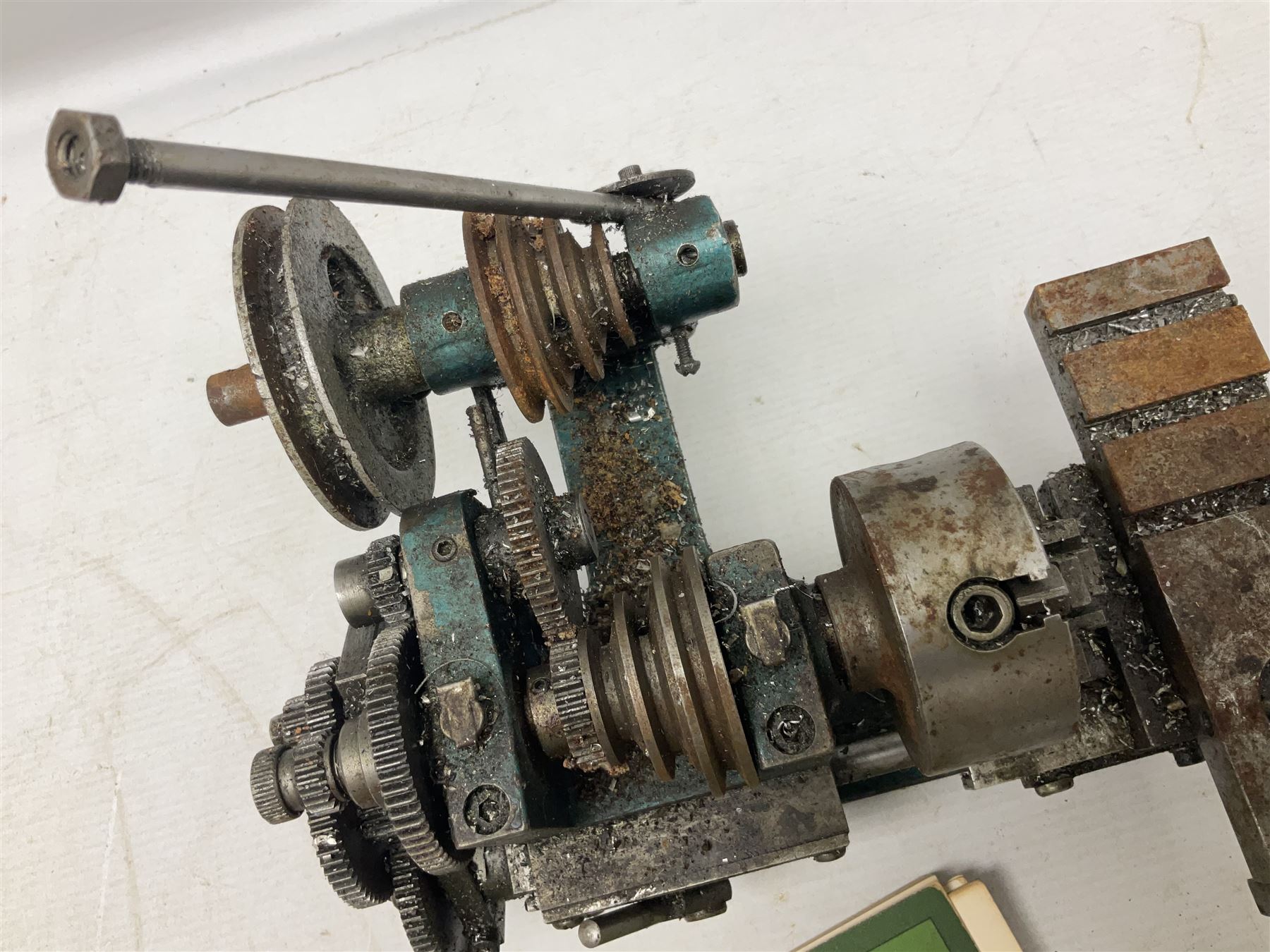 Cowells of Norwich model 90 modelmaker's lathe with handbook, the Pratt Bernard 4-jaw chuck with 4cm centre height and 7.5cm throw L44.5cm; together with an unrelated Hobbymat horizontal cross-slide with 4-way tool post (2)
