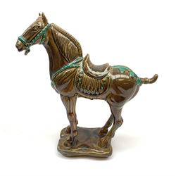 A large Beswick figure modelled as a Tang horse, with impressed marks beneath, H34cm.