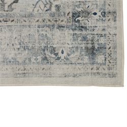 Ruggable - ‘Sarrah’ blue quartz flatwoven washable rug, ivory ground with blue and grey floral medallion, scrolling foliage and patterned borders, with a distressed effect finish, two-piece construction comprising a removable cover and separate pad, with a water-resistant and stain-resistant polyester barrier