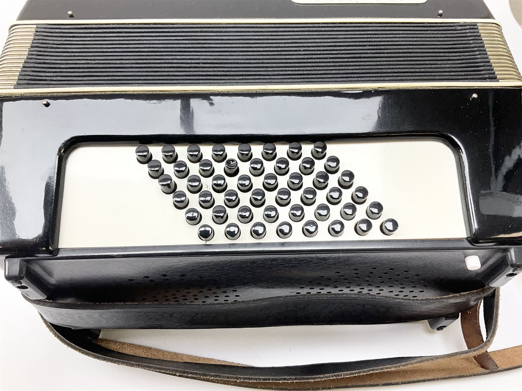 GDR Firotti piano accordion with black and silver case, sixteen keys and forty-eight buttons L38cm; in simulated reptile skin case with sheet music