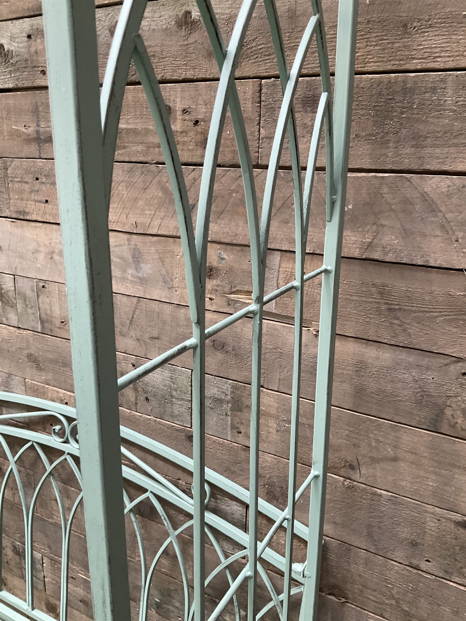 Regency design wrought metal arch and bench, decorated with arched gothic window design, strap seat and straight supports, in teal finish - THIS LOT IS TO BE COLLECTED BY APPOINTMENT FROM DUGGLEBY STORAGE, GREAT HILL, EASTFIELD, SCARBOROUGH, YO11 3TX