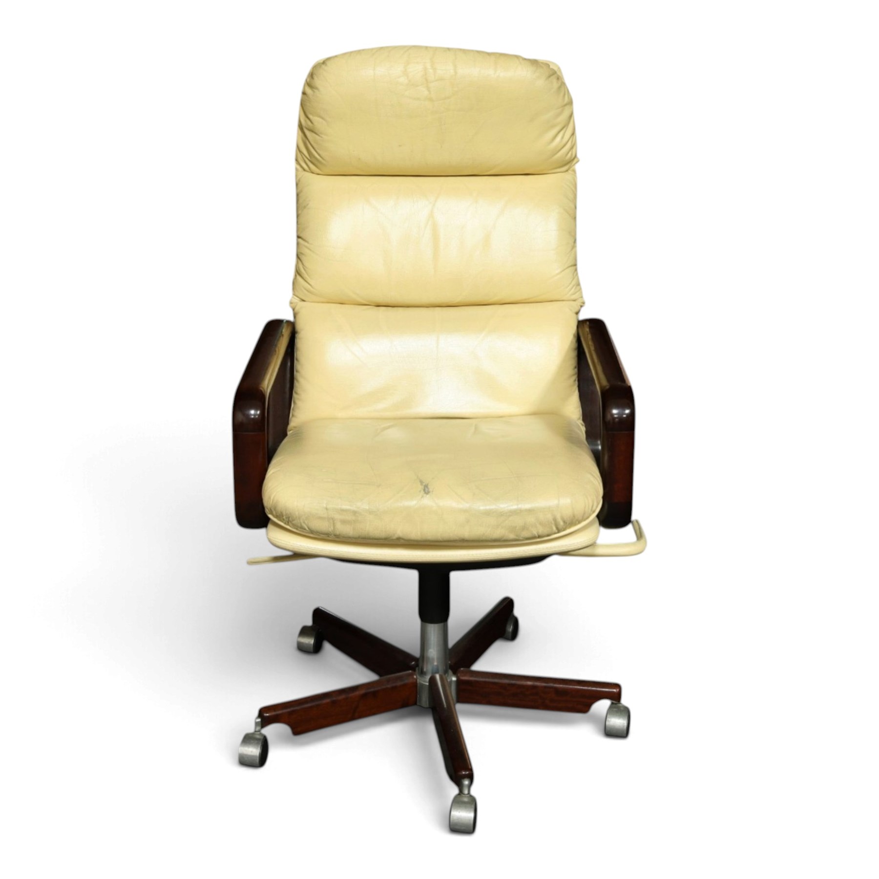 Dyrlund - Santos rosewood office suite, comprising an executive desk and cream leather upholstered swivel chair, the desk with a broad rectangular top with rounded corners, leather writing surface, pen compartments and letter tray, three lockable frieze drawers with fitted interiors above a central kneehole flanked by floating drawer pedestals, the left housing a filing drawer and the right three compartmented drawers, with a full width modesty panel to the reverse, chair raised on a castor base, H 116cm, W 62cm, D 74cm