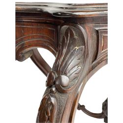 19th century Irish rosewood centre table, the shaped and moulded top over shaped apron carved with scrolled foliage, on serpentine supports carved with bell flowers, the supports united by anthemion carved finial and s-scroll x-framed stretchers
