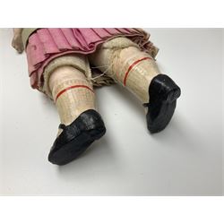 Victorian wax shoulder head doll with applied hair, inset glass eyes and jointed body with composition lower limbs; faded pink dress H35cm