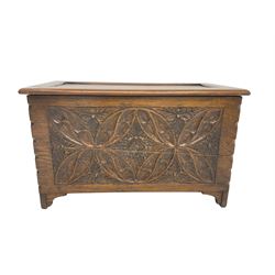 Small 20th century oak coffer, panelled hinged lid over carved front, decorated with floral lozenge motifs, on bracket feet