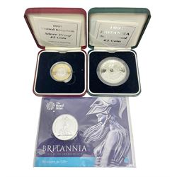 The Royal Mint United Kingdom 2015 fine silver fifty pound Britannia coin, on card, Queen Elizabeth II 1997 silver proof Britannia and 1997 silver proof two pound coin, both cased with certificates 