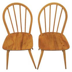 Ercol - set of four 'Windsor' waxed elm chairs, with hoop back design, on tapering supports