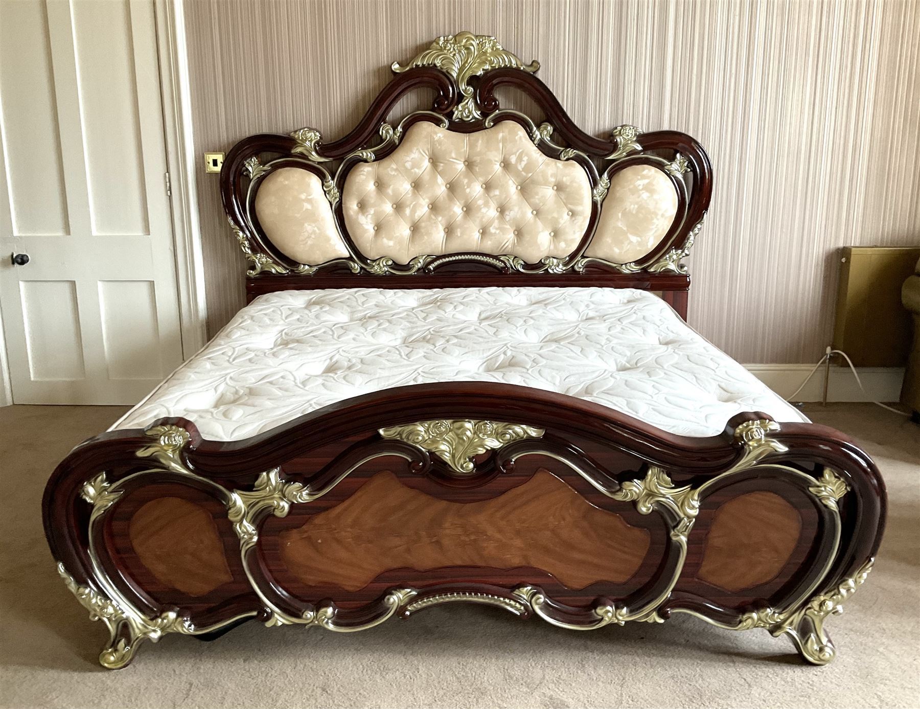 Rococo style 6' Super Kingsize bed, ornate shaped and floral design in wood finish, upholstered buttoned headboard, decorated with scrolled foliate and flower heads, together with mattress