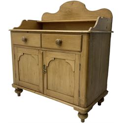 Victorian polished pine washstand side cabinet, raised back with shelf, fitted with two drawers over panelled cupboard, on turned feet