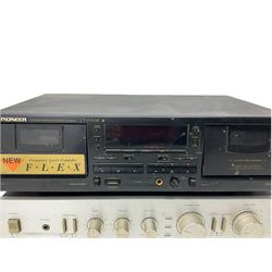 Rotel record player with pioneer amps and cassette deck with a pair of Wharfdale speakers