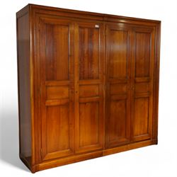 Brigitte Forestier - French cherry wood four door wardrobe unit, fitted with hanging and shelving