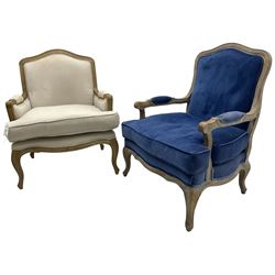 Near pair of French Louis XV design light oak framed bedroom armchairs, shaped back and apron, upholstered in blue and cream fabric with loose seat cushions, on cabriole supports