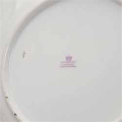 Davenport porcelain dessert plate, painted with a figure and cottage in a rural landscape, within a raised gilt border, D24cm, a 19th century English porcelain twin handled dessert dish, together with an early 19th century porcelain cabinet plate, painted with a river landscape within a gilt border, possibly Derby, unmarked, D22cm (3)