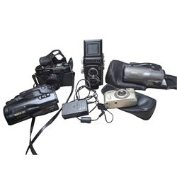 Two Canon Epoca video cameras, a Hacoflex twin lens camera, Yashica Electro 35 camera and a Kyocera Zoomate 140