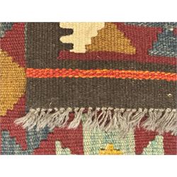 Maimana Kilim ground runner, multicoloured geometric medallions arranged in rows, with triangular motifs in the field, the wide border in brown with contrasting guard bands