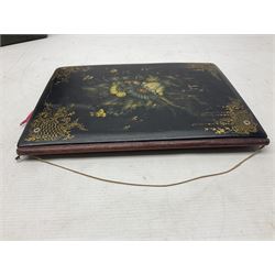 Victorian desk ink blotter, decorated with painted spray of flowers within stylised gilt rococo spandrels with mother of pearl fixings, together with a Victorian photo album containing interior leaves with apertures of various sizes and shapes of portraits surrounded by printed sea and dock scenes, blotter L28cm