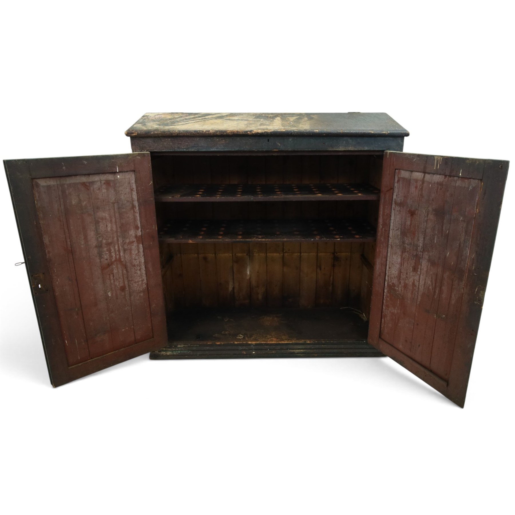 19th century painted and lacquered pine clerks desk bureau on cupboard, hinged fall-front enclosing three compartments, over slatted panelled doors enclosing two perforated shelves, on skirted base, in rustic forest green and red finish