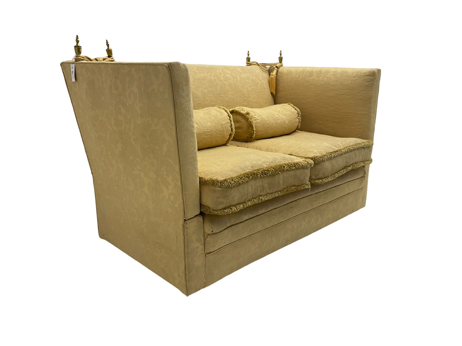 Edwardian knole design drop-arm two seat sofa, upholstered in yellow damask fabric with sprung back and seat and matching bolster cushions