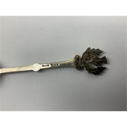 Two silver napkin rings, silver spoon with thistle top terminal, two silver handled butter knives, and small glass jar with silver cover, all hallmarked, approximate weighable silver 53.7 grams