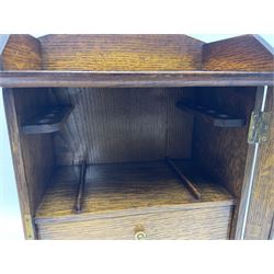 Edwardian oak smokers cabinet with the single glazed door to fitted interior having a single draw and pipe rack, H40cm