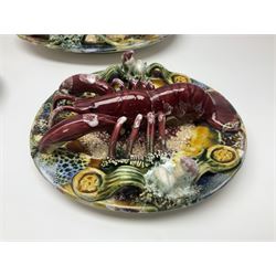 Five 20th Century Portuguese Palissy style Majolica wall plates, all depicting crustaceans to the centre modelled in relief surrounded by encrustations and shells, both with impress marks beneath, largest D29cm