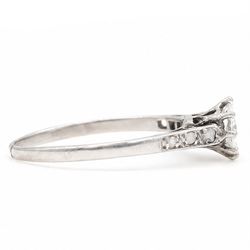 Early 20th century white gold and platinum diamond ring, eight claw set with a single old cut diamond of approx 0.70 carat and rose cut diamond shoulders, stamped PLAT 18ct