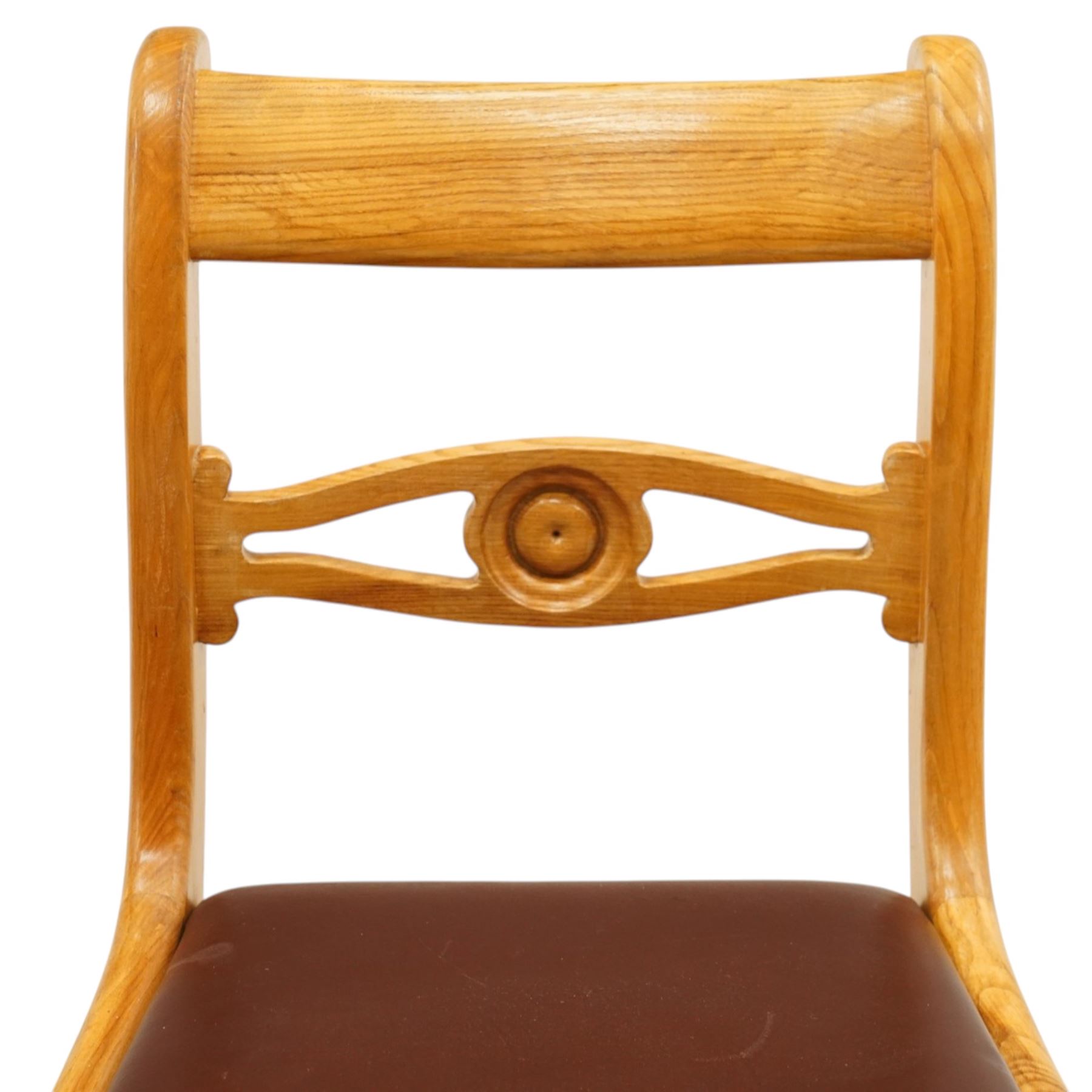 Seahorseman by Shaw & Riley - set of four Yorkshire oak bar-back dining chairs, brown vinyl drop in seat, raised on shaped supports with signature Seahorse carving from the workshop of A. Shaw & Riley Ltd, Hessay