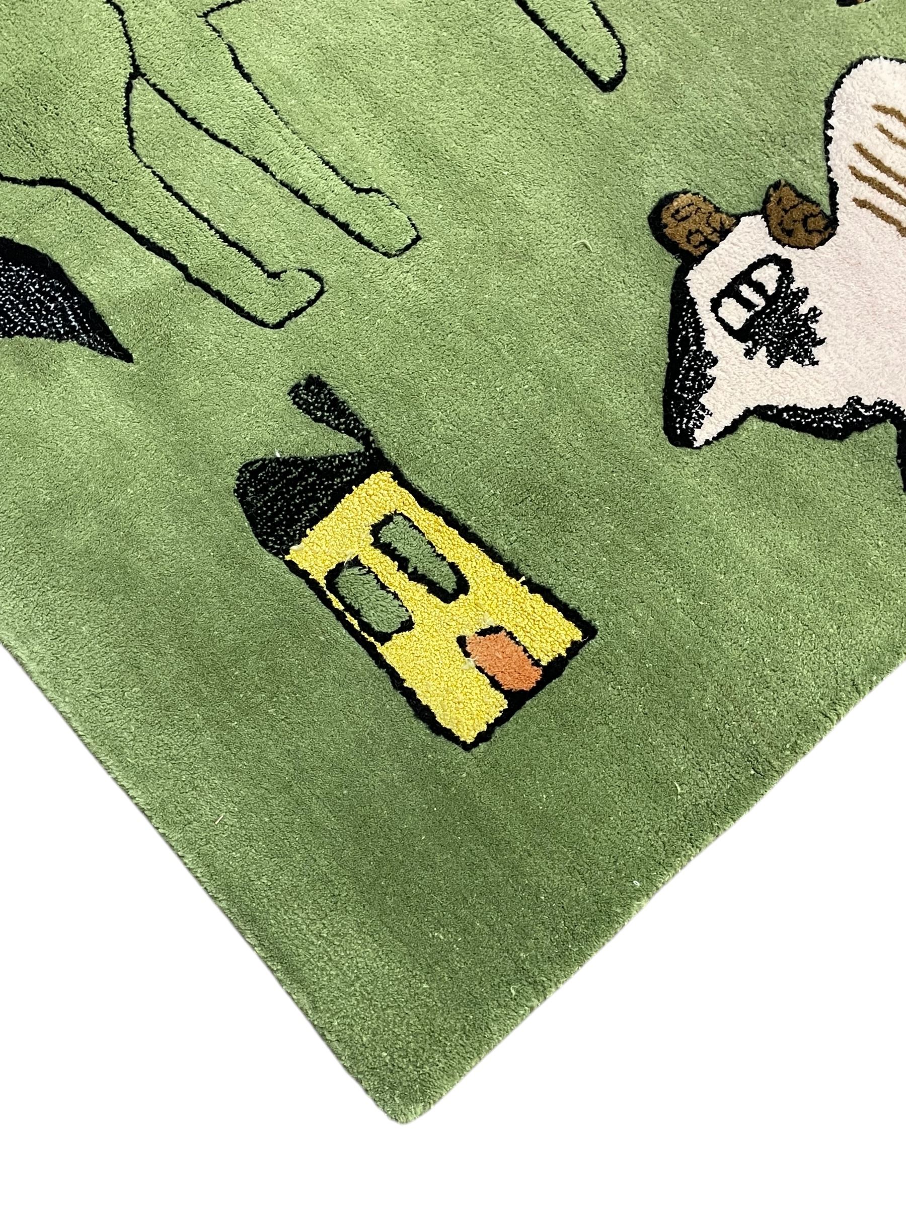 Shrimps for Habitat - 'Wilder' hand tufted green ground rug decorated with abstract motifs of animals, faces, shells and houses 