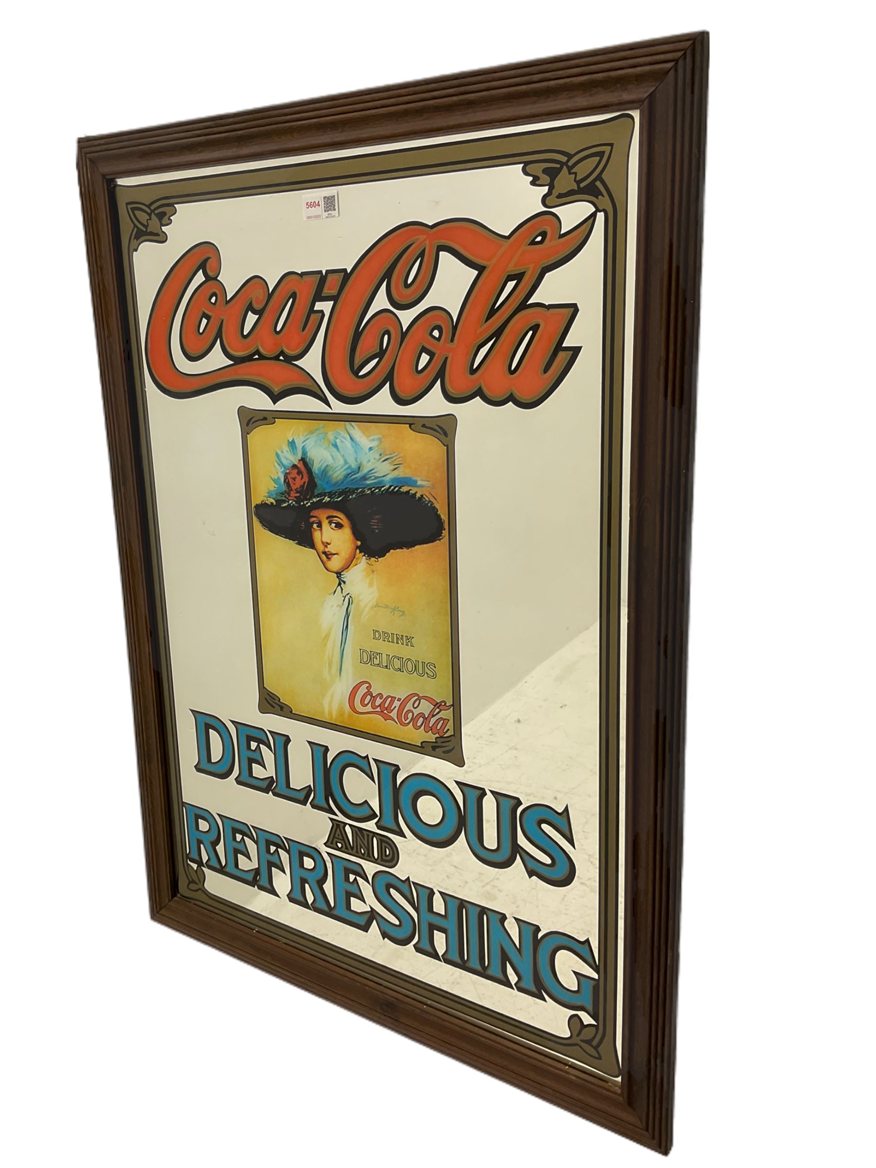 Late 20th century 'Coca Cola' style mirror (64cm x 89cm), and a 20th century frameless mirror (44cm x 67cm)