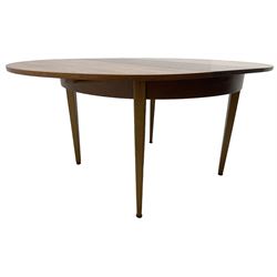 G-Plan - mid-20th century teak extending circular dining table, with concealed additional leaf (W114cm, H72cm); and a set of four mid-20th century teak dining chairs, seat upholstered in beige fabric
