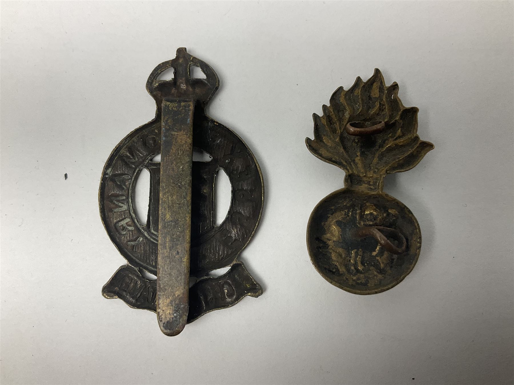 Nineteen Yeomanry metal cap badges including Derbyshire, Northamptonshire, Essex, Glamorgan, Staffordshire, City of London, Surrey, Shropshire, Hertfordshire etc; together with eleven Fusiliers badges including Lancashire, Royal Welch, Northumberland etc (30)