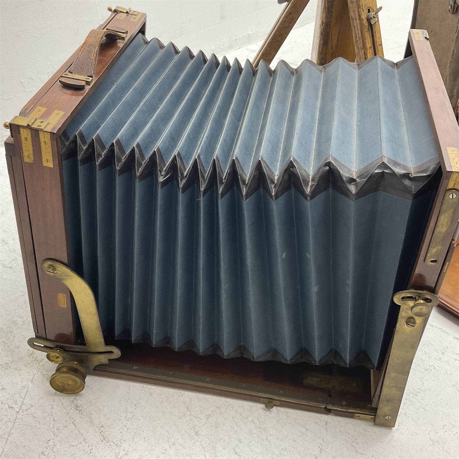 Kieser & Pfeufer folding mahogany and brass full plate camera, with adjustable wooden tripod