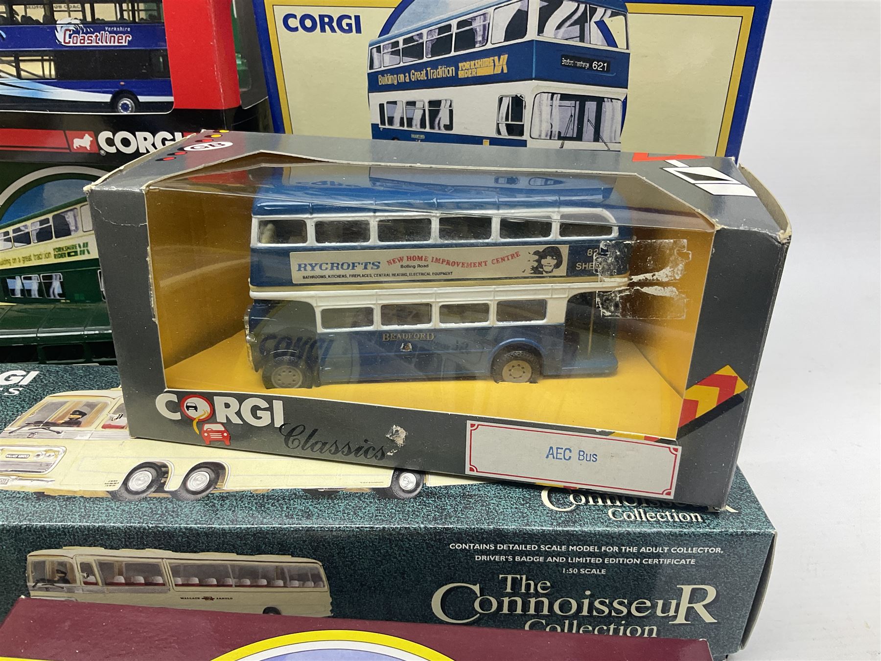 Corgi - twenty eight modern die-cast model coaches, buses and wagons to include Corgi Classics 35305, 96991, 97002, two 97108, 97208, 97267, 97335, 97871 and 98162; limited edition sets D949/26, 97107 and 97185; The Yorkshire Rider Series 91700, 91853, 91858 and 91862; all but one in original boxes or perspex display cases, most with certificates (27)