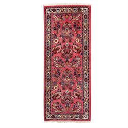 Persian rose ground runner rug, the field decorated with repeating polychrome floral spray...