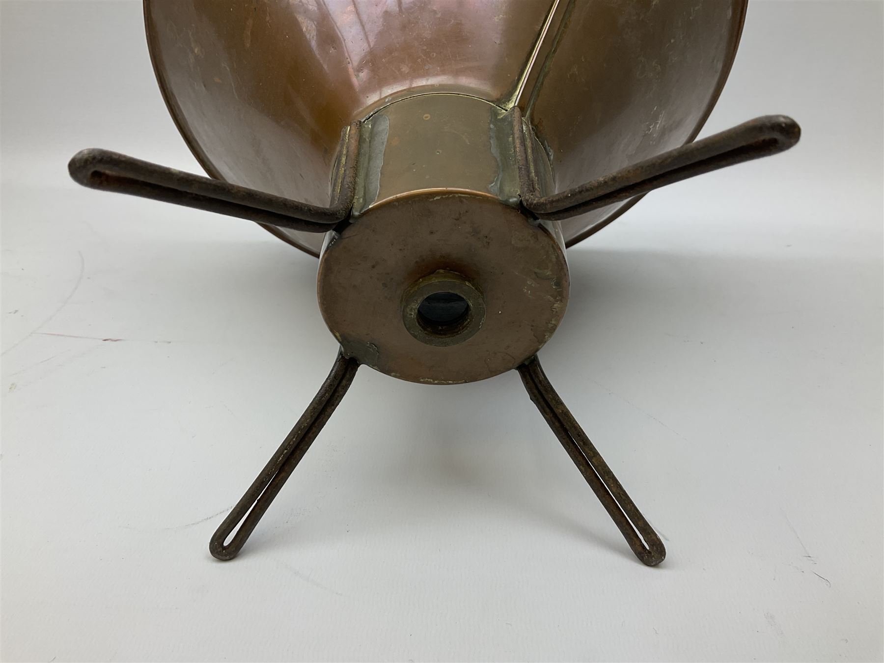 Agricultural copper corn funnel, H32.5cm, another similar copper funnel and copper warming platter of oval form, with twin handles on four supports, with removeable warming plate, L49cm