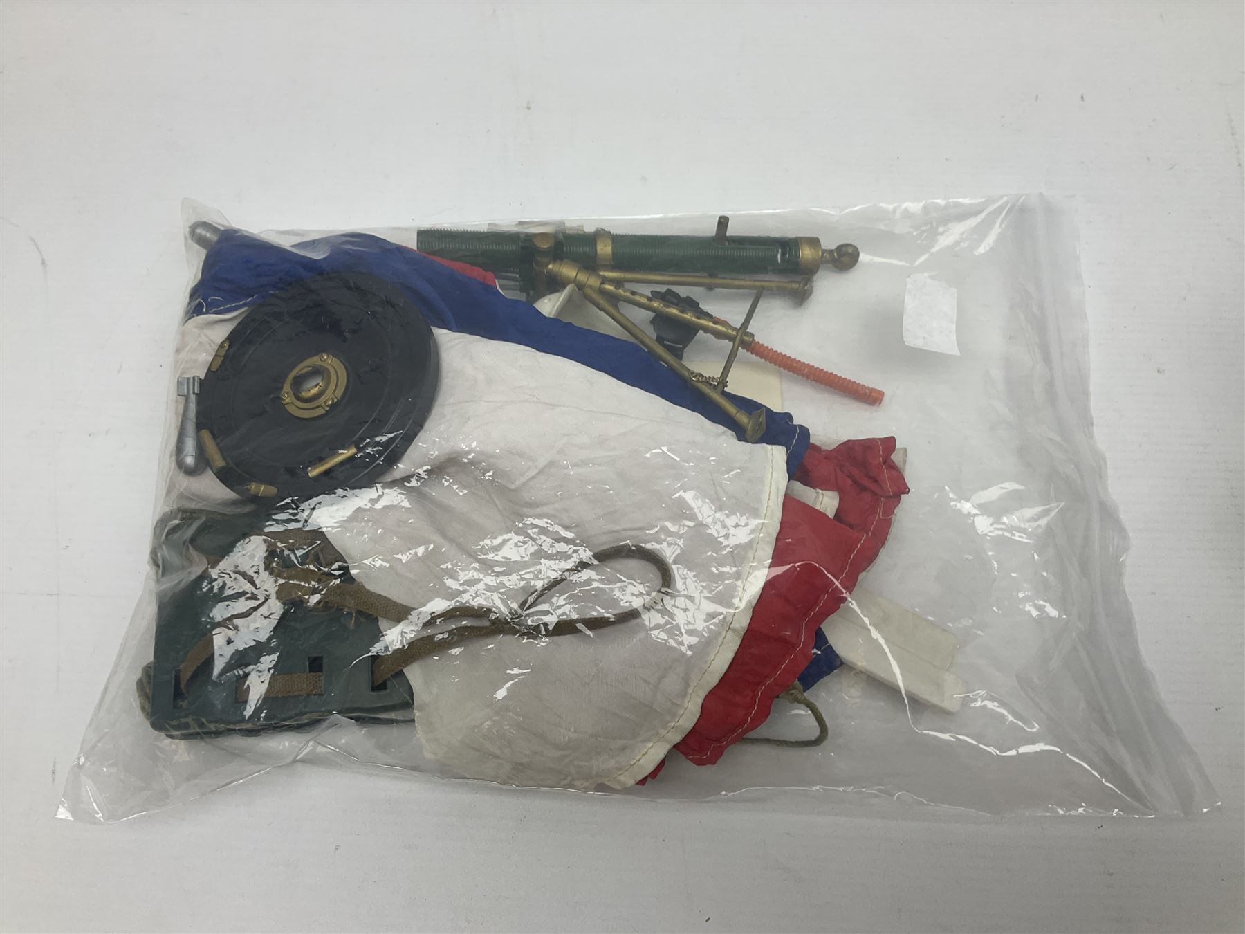 Action Man - five figures marked on the back 'Made in England by Palitoy under licence from Hasbro 1964', one dressed as a German Stormtrooper, one as a Red Devil Pilot and three in army uniform; another similar action figure marked to the right buttock ' G.I. Joe Copyright 1964 by Hasbro Patent Pending Made in Canada' dressed in army uniform; together with an Action Man jeep, field gun, mortar and machine guns and other accessories including helmets and weapons, parachute, diving equipment, skis and snow shoes, boots, uniforms etc; all unboxed